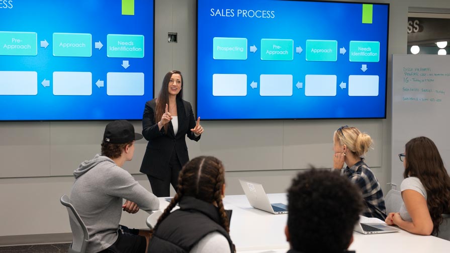 Stefanie Boyer, Ph.D., professor of Marketing and director of the Bryant University Sales Program leads a class in the new Frank ’81 and Marion ’81 Hauck Sales Performance Lab’